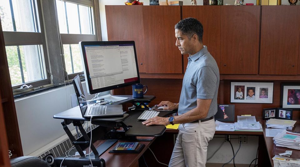 Ron Metoyer standing at his desk